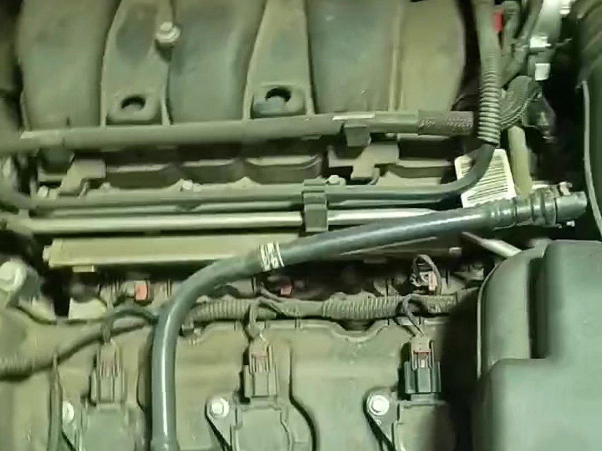 Top of an engine with the hood up during a timing chain job
